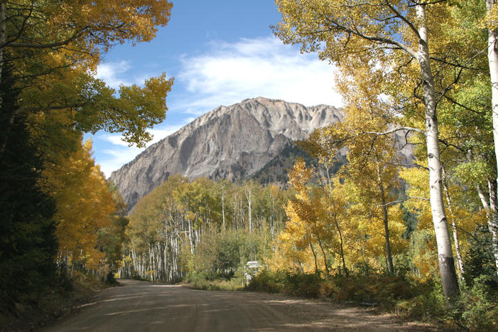 mountain and road with aspens